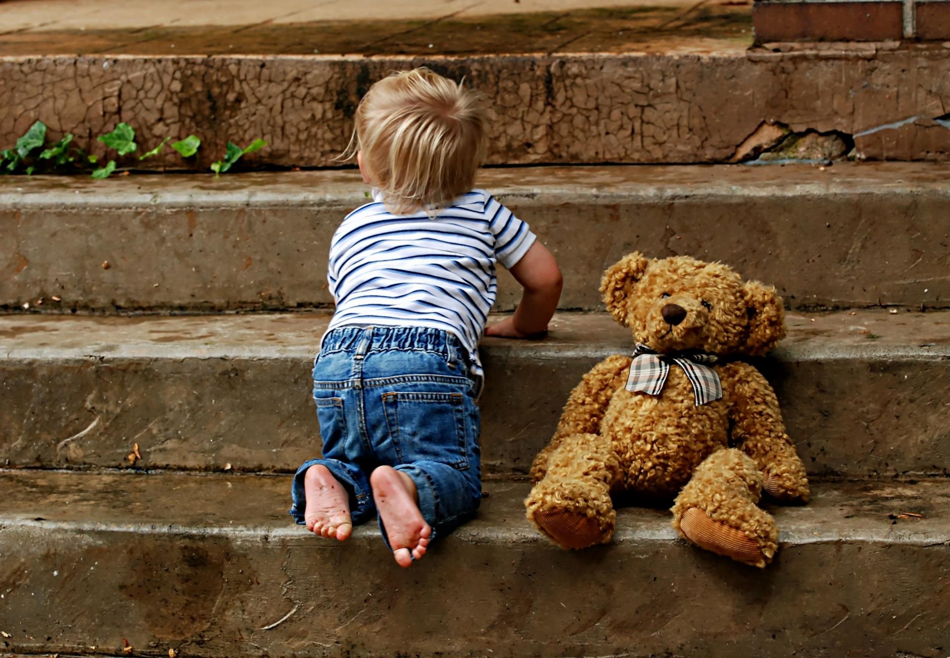 Canva - Blonde Child and Teddy Bear on a Stairway